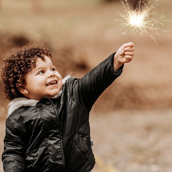 a boy with sparklers living a purpose driven life